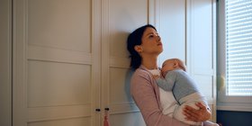 fed-up-woman-holding-baby.jpg