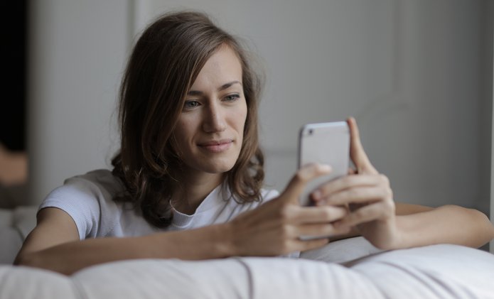 slightly-smiling-woman-looking-at-phone.jpg