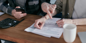 hands-of-two-people-filling-out-form.png