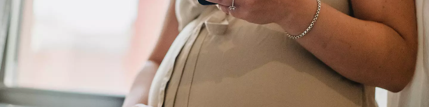pregnant lady on mobile phone.webp