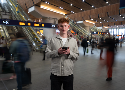 Freddie-smiling-train-station-connection.png